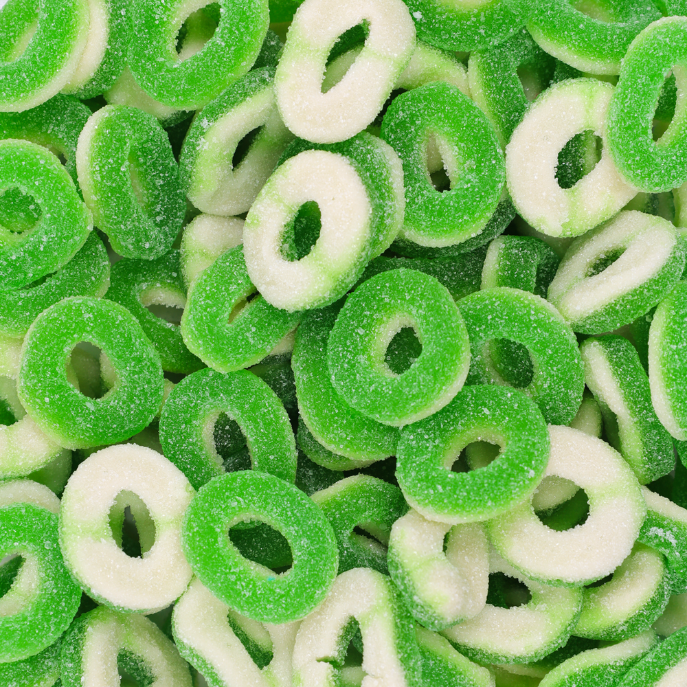 Close-up of green and white gummy rings.