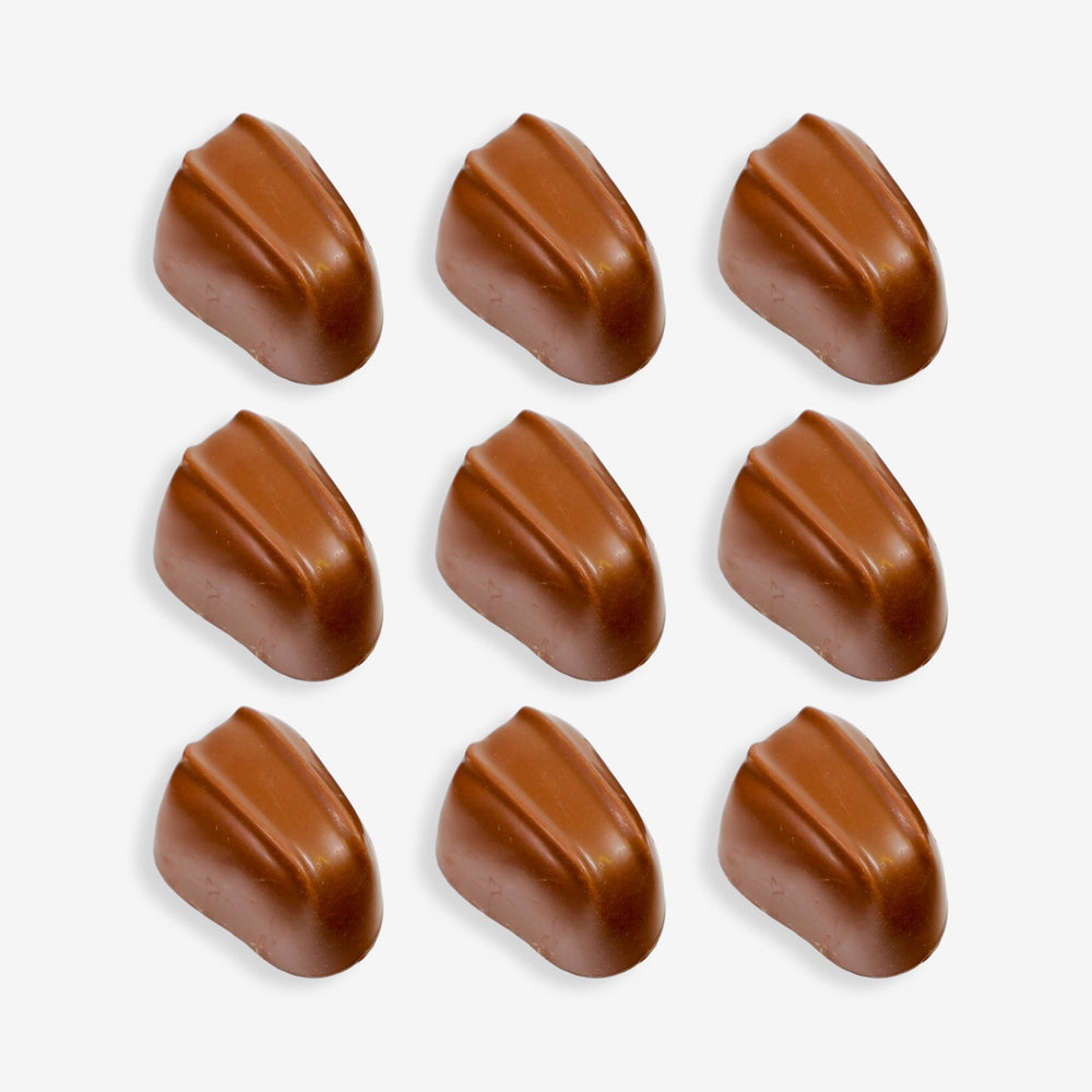 Nine brown chocolate candies arranged in a 3x3 grid on a white background