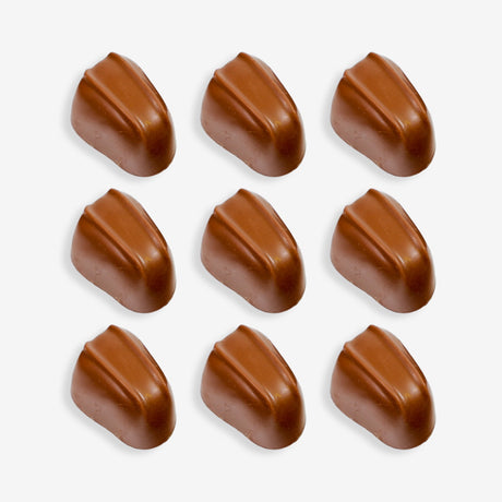 Nine brown chocolate candies arranged in a 3x3 grid on a white background