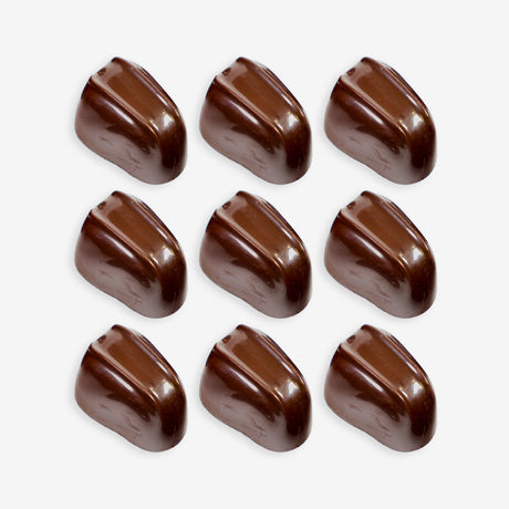 Nine chocolate candies arranged in a 3x3 grid on a white background