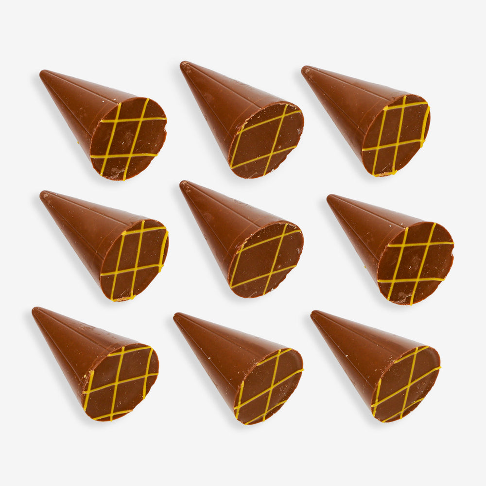 Nine chocolate cones with a yellow grid pattern on a white background