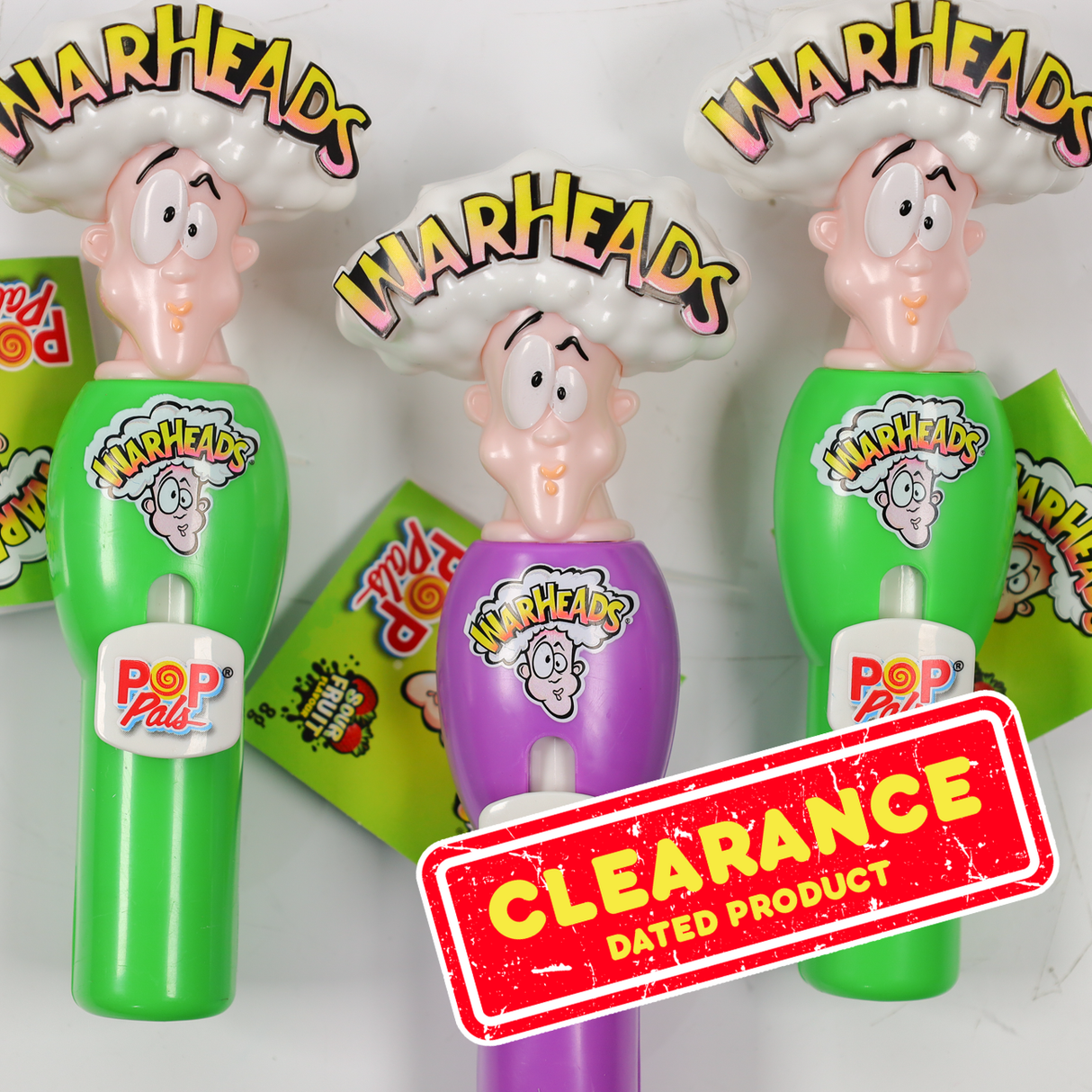 Warheads Pop Pack candy containers with colorful packaging and 'Clearance' label.