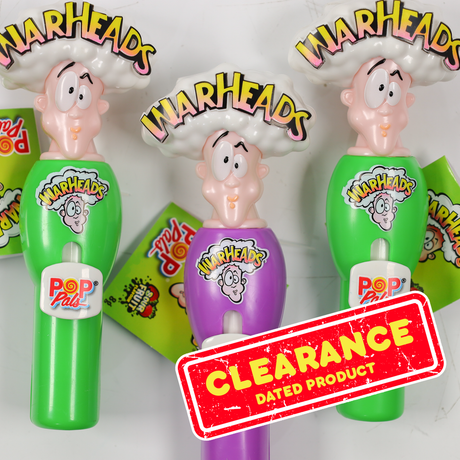 Warheads Pop Pack candy containers with colorful packaging and 'Clearance' label.