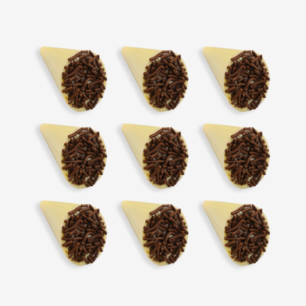 White chocolate cone with chocolate sprinkles on a white background