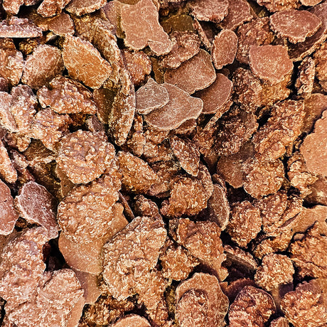 Close-up of brown coconut chocolate clusters.