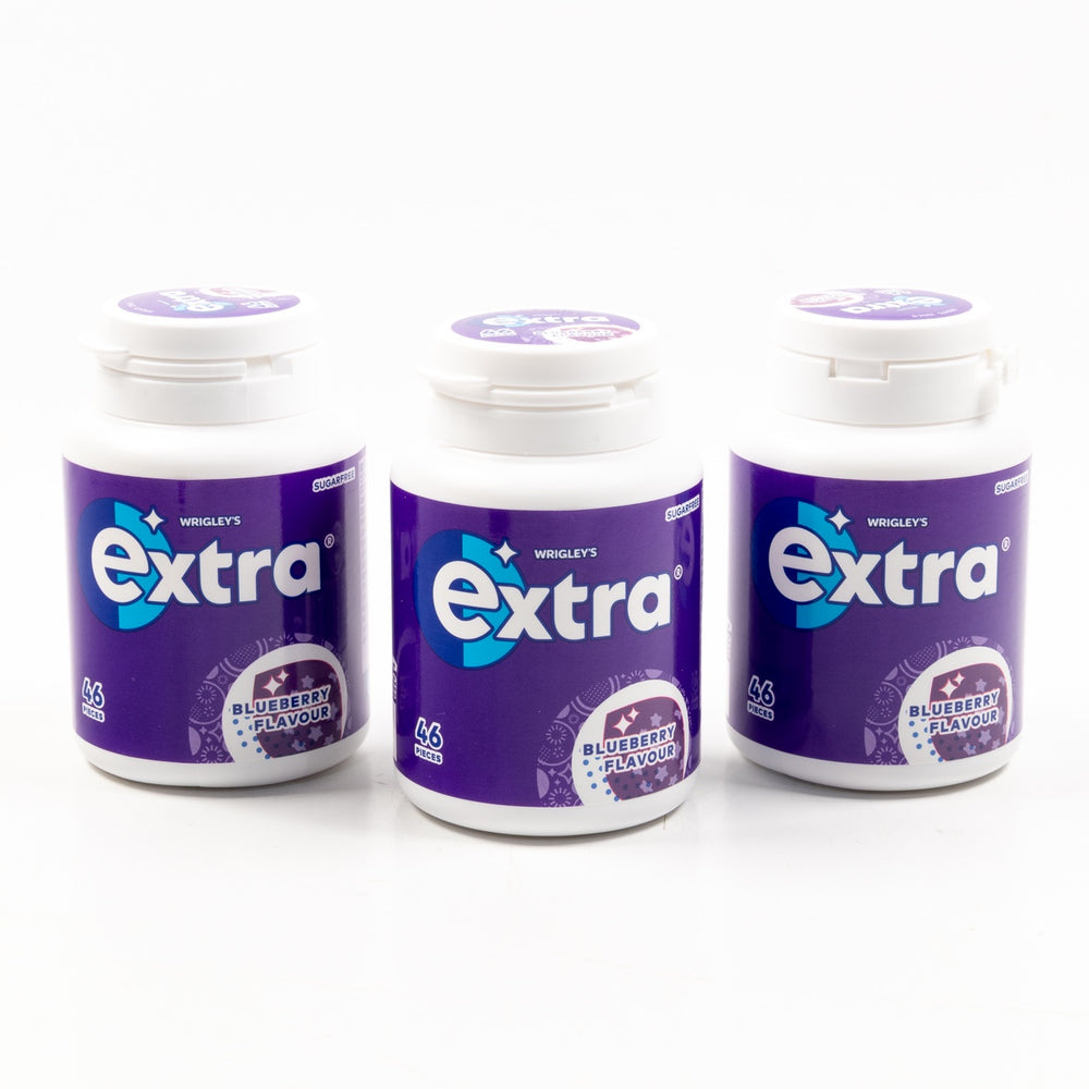 Three bottles of Wrigley's Extra gum with blueberry flavor on a white background